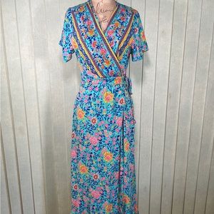 Medium fitted short sleeve light blue floral true wrap dress or cover up.